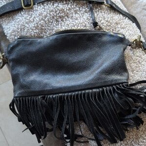 Elegant Black Leather Crossbody Bag with Fringe